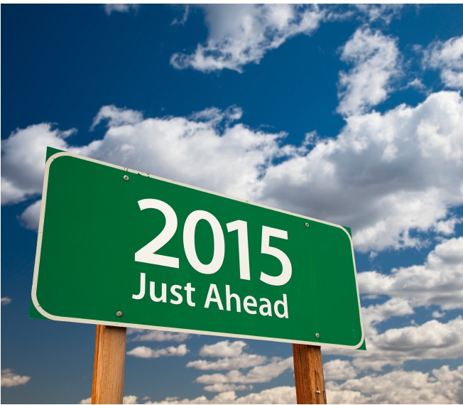 2015 Just Ahead Green Road Sign Over Dramatic Clouds and Sky.